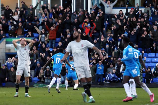 Happy Posh fans and dejected Exeter players after Kwame Poku's winning goal. Photo Joe Dent/theposh.com.