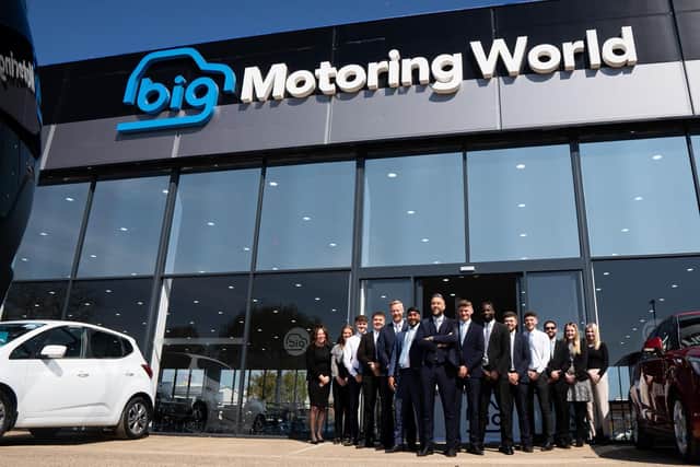 Some of the staff at the new-looking Big Motoring World showroom in Fengate, Peterborough, which has just undergone a £4 million renovation.