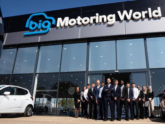 Some of the staff at the new-looking Big Motoring World showroom in Fengate, Peterborough, which has just undergone a £4 million renovation.