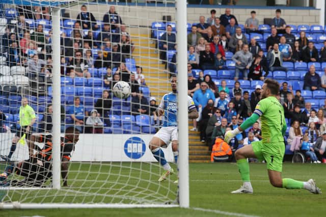 Jonson Clarke-Harris of Peterborough United scores the opening goal of the game against Blackpool. Photo: Joe Dent/theposh.com