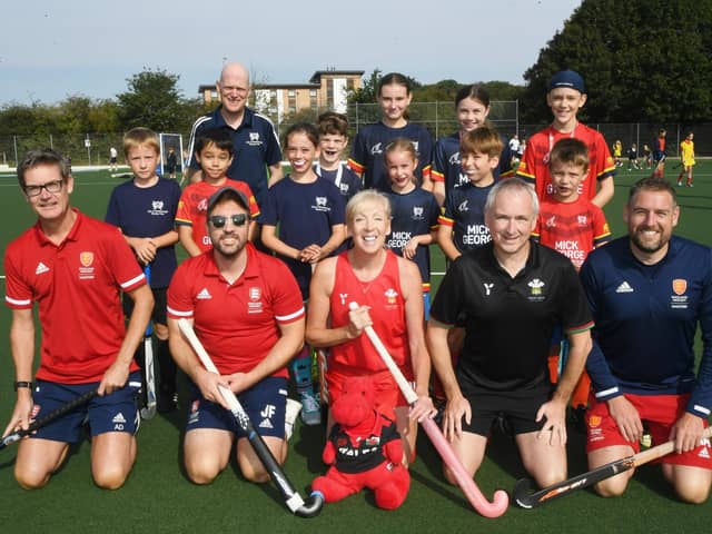 Participants at City of Peterborough's mini hockey sessions with senior stars, front from left, Adam Drake, Joe Finding, Sue McNaughton, Jonathan Short and Gareth Andrew. Photo: David Lowndes.