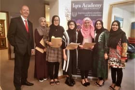 Principal Michael Wright with successful GCSE students at Iqra Academy.