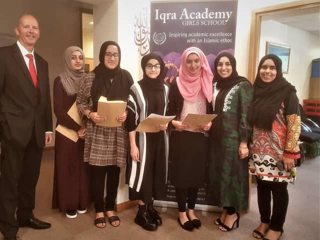Principal Michael Wright with successful GCSE students at Iqra Academy.