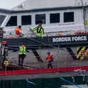 Migrants are brought into Dover Port by Border Force officials after being picked up in the English Channel while trying to make the journey from France in inflatable dinghies on . (Photo by Chris J Ratcliffe/Getty Images)