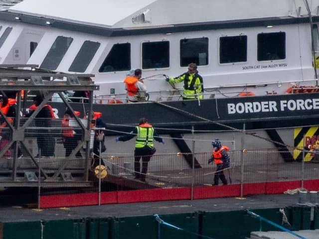 Migrants are brought into Dover Port by Border Force officials after being picked up in the English Channel while trying to make the journey from France in inflatable dinghies on . (Photo by Chris J Ratcliffe/Getty Images)
