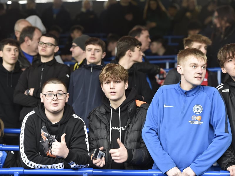 Peterborough United fans watch the defeat against Bolton Wanderers.