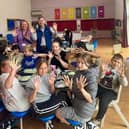 Andrew Pakes MP alongside Kids and Volunteers at Thomas Deacon Academy