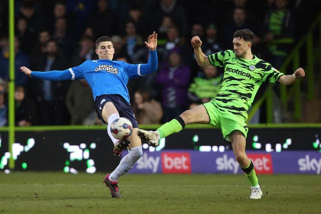 Ronnie Edwards of Peterborough United battles with Corey O'Keeffe of Forest Green Rovers. Photo: Joe Dent/theposh.com.