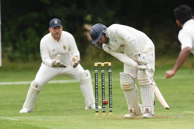 Castor's Tom Beale is bowled during the Canbs League win over Stamford Town. Photo: David Lowndes.