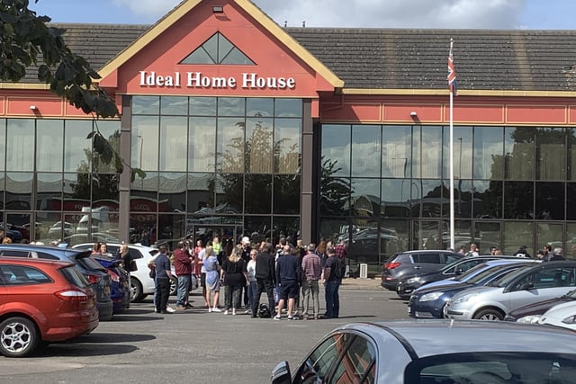 Workers gather at Ideal World before being told the company is to close