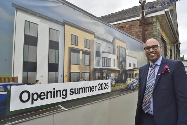 Doctor Neil Modha with the plans for the new hydrotheraphy pool at  Thistlemoor Medical Centre in 2024