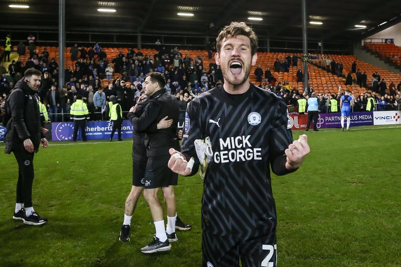 Goalkeeper Jed Steer celebrates the victory at full-time.