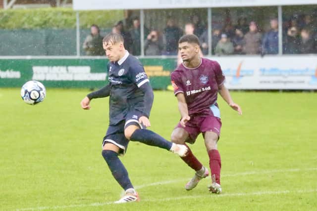 Lewis Darlington (right) in action for Bourne Town against Banbury United. Photo Jason Richardson
