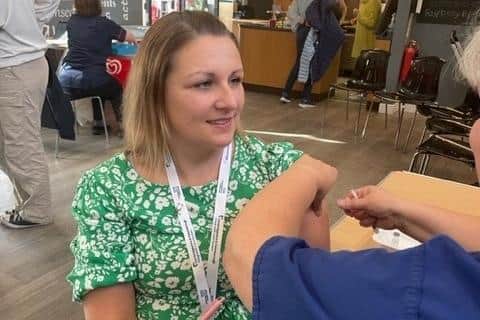 Cali Makewell having her flu vaccine.