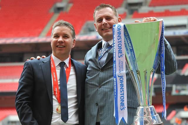 Posh manager Darren Ferguson (left) and chairman Darragh MacAnthony with the EFL Trophy after their club's success in 2014. Photo: David Lowndes.