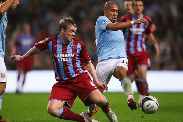 Grant McCann (left) playing for Scunthorpe against Manchester City in 2009. (Photo by Alex Livesey/Getty Images)