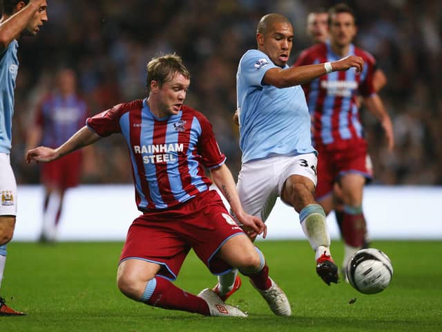 Grant McCann (left) playing for Scunthorpe against Manchester City in 2009. (Photo by Alex Livesey/Getty Images)