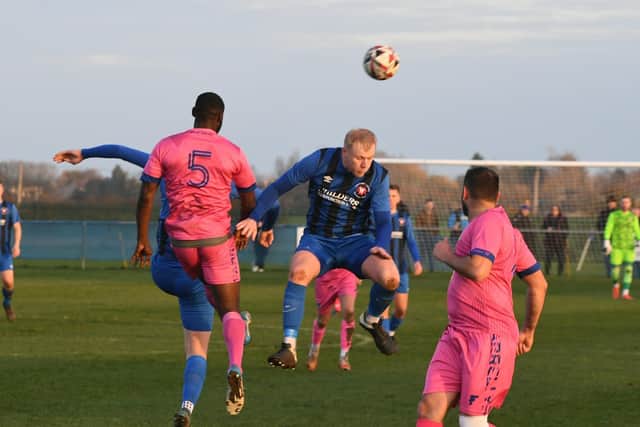 FA Vase action from Whittlesey Athletic (Blue) v Romford. Photo: David Lowndes.