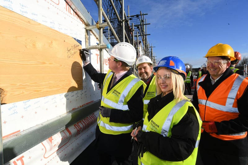Topping out ceremony at ARU Peterborough's phase 3 building at Bishop's Road with Dr Nik Johnson,  Peterborough MP Paul Bristow and student Nikkii Firth with university principal Ross Renton