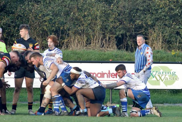 Andy Moore (background) watching Peterborough Lions in action.