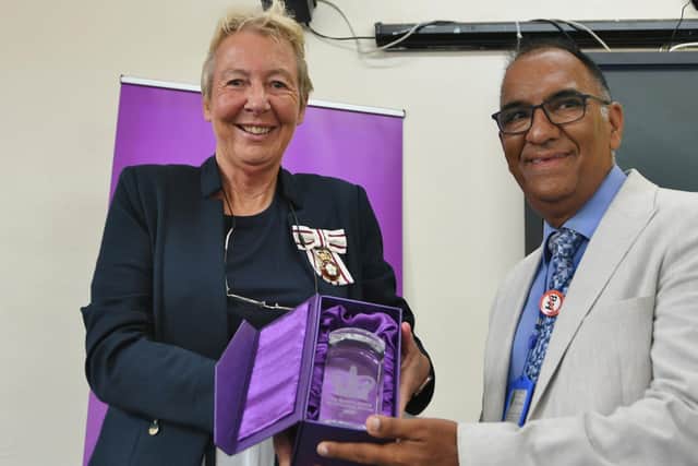 Moez Nathu CEO of PARCA (right) receiving the Queens Award for Voluntary Service at Unity Hall in 2022.