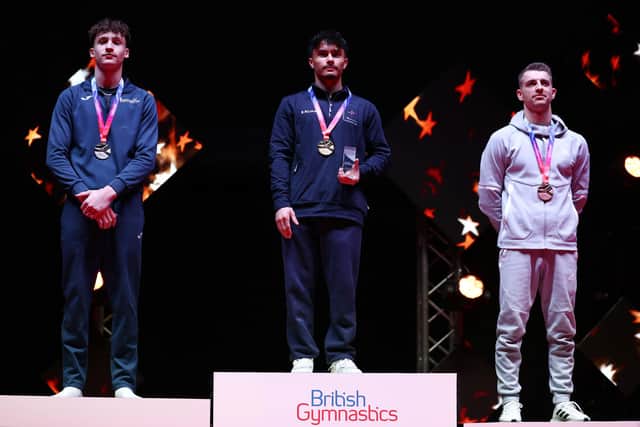 Jake Jarman on top of the podium after winning gold on the horizontal bar at the British Championships. GB legend Max Whitlock OBE took bronze. Photo by Naomi Baker/Getty Images.