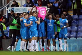 Peterborough United's players show their support for Josh Knight after the opening goal. Photo: Joe Dent.