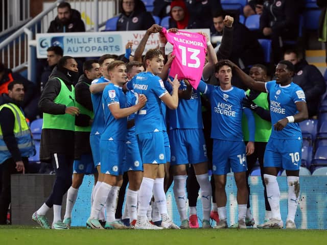 Peterborough United's players show their support for Josh Knight after the opening goal. Photo: Joe Dent.
