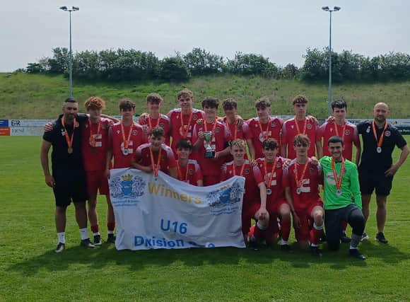 Stamford AFC Under 16s with their trophy and medals after clinching the Peterborough & District League Division One title.