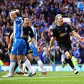 Craig Mackail-Smith celebrates scoring the second goal of the game as Posh clinch play-off success against Huddersfield Town.