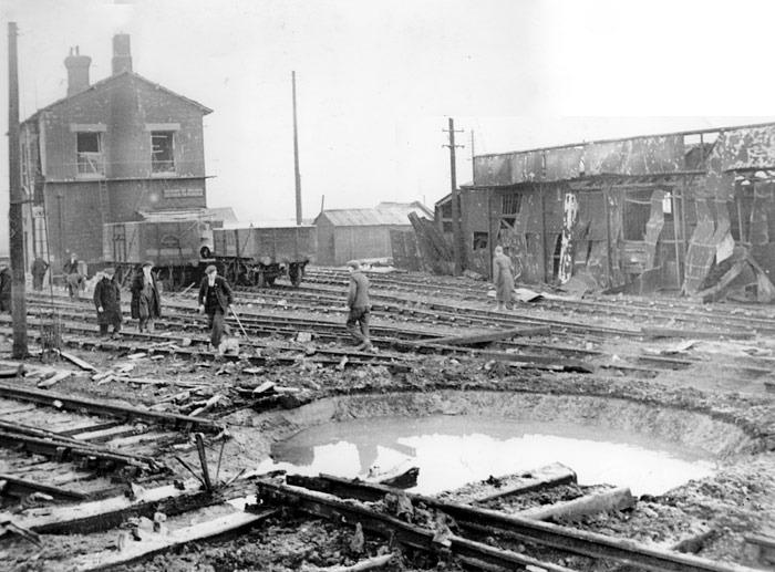 Striking images showing the aftermath of a German bombing raid with workers trying to put right the considerable damage made to the New England yards near to the New England Loco Shed.
