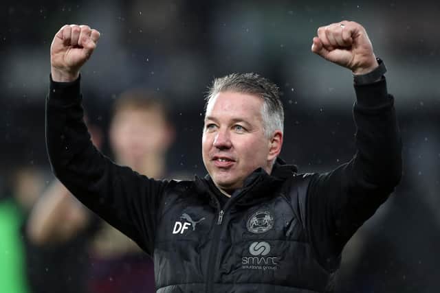 Peterborough United Manager Darren Ferguson celebrates the victory at Derby County. Photo: Joe Dent/theposh.com.
