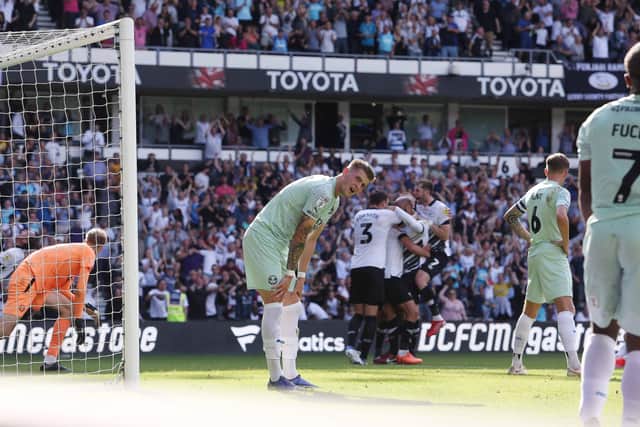 Josh Knight disappointed as Posh concede in stoppage time against Derby. Photo: Joe Dent.