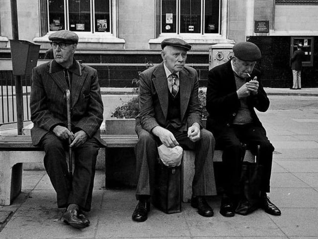 Three gentlemen putting the world to rights in Cathedral Square