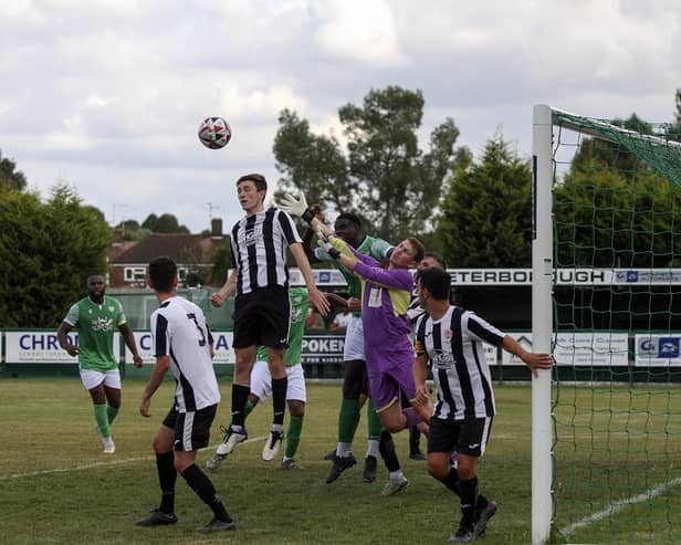 Action from FC Peterborough (green) v Harwich & Parkston. Photo: Tim Symonds
