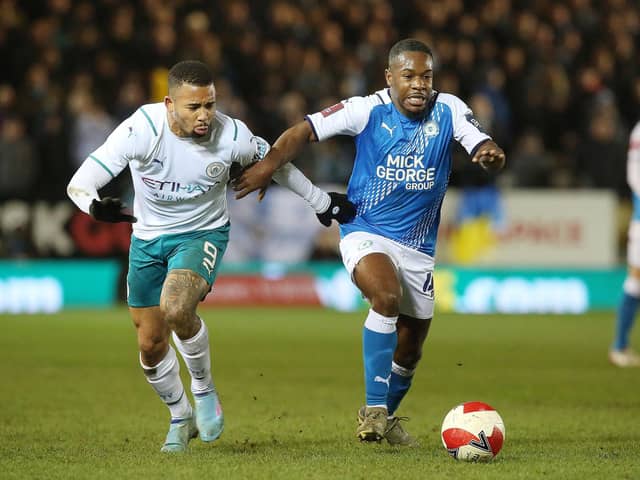 Posh midfielder Jeando Fuchs in action against Gabriel Jesus of Manchester City in an FA Cup tie in March 22. Photo: Joe Dent/theposh.com.