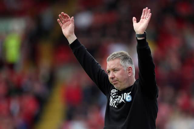 Peterborough United manager Darren Ferguson acknowledges the supporters after the win at Barnsley. Photo: Joe Dent/theposh.com