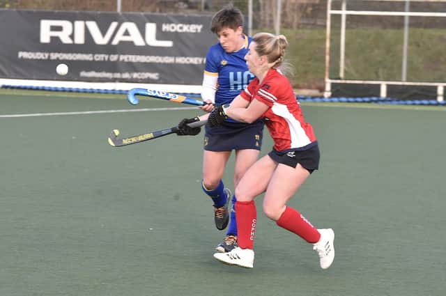 Hockey action from City of Peterborough Ladies 1sts (red) v Blueharts at Bretton Gate. Photo: David Lowndes.