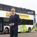 Darren Roe and an electric bus