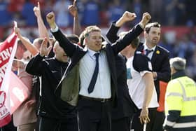 Posh boss celebrates promotion from League One at Old Trafford in May, 2011. Photo: Peter Byrne/PA.