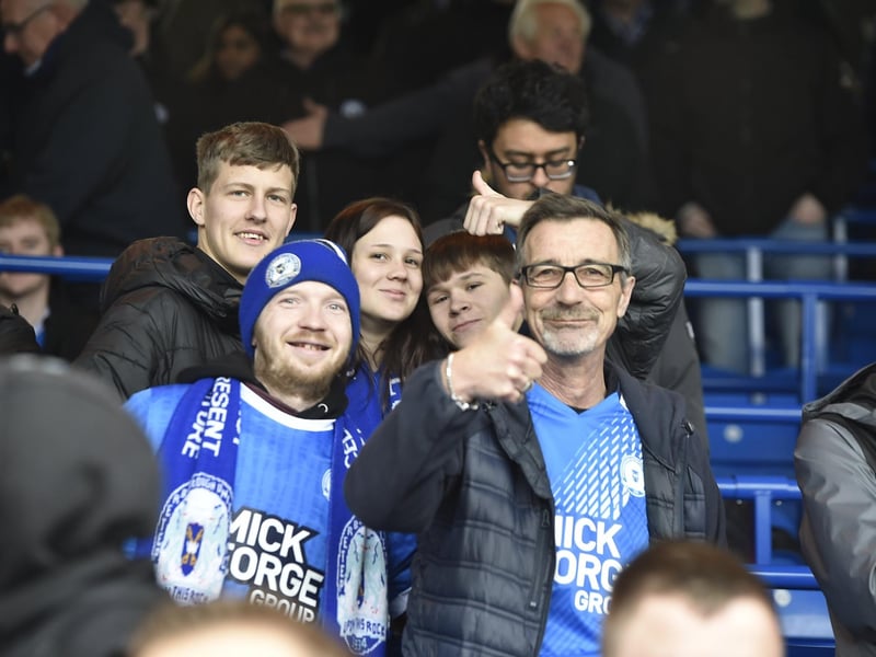 Peterborough United fans watch the defeat against Bolton Wanderers.