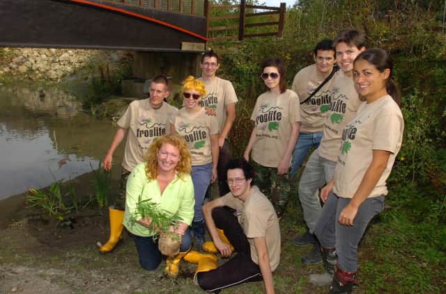 TV gardening guru Charlie Dimmock assisting Froglife volunteers working to improve the ponds at Railworld in 2011