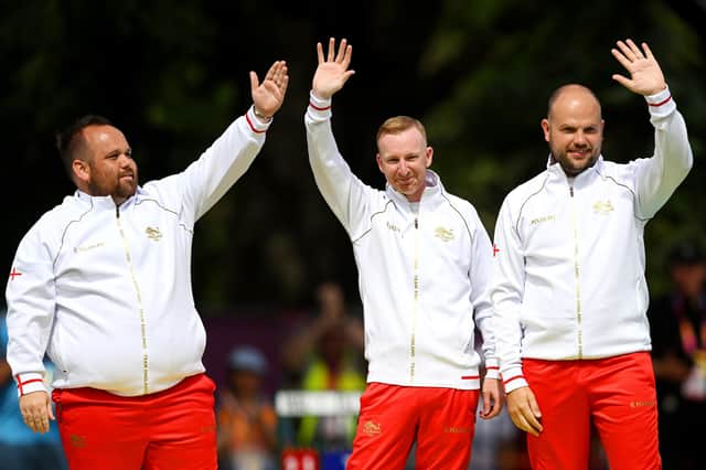 Nick Brett (centre) after the Gold medal ceremony at the Commonwealth Games. Photo: Nathan Stirk, Getty Images.