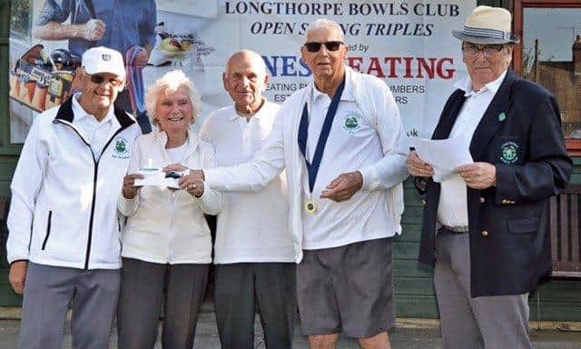Winners of the Longthorpe mixed triples - Lynne Henson, Greg Boyall and Peter Harradine - pictured with club president Ray Hibbard and organiser Dick Harrison.