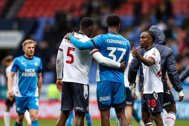 Emmanuel Fernandez with former Posh player Ricardo Santos after the defeat at Bolton. Photo Joe Dent/theposh.com
