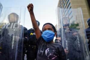 A young boy raises his fist during a demonstration in Atlanta, Georgia (Photo: Elijah Nouvelage/Getty Images)