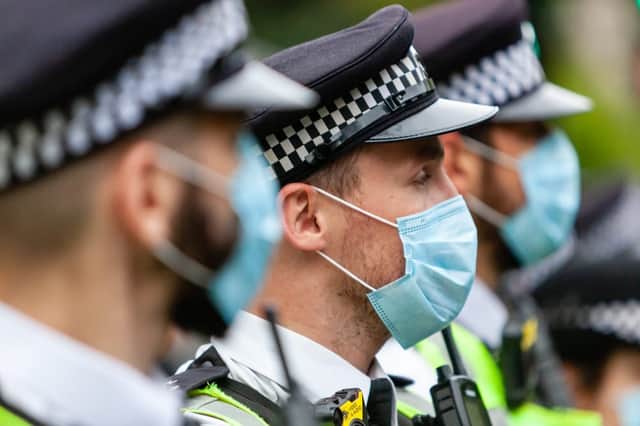 1 in 5 police officers have reported being spat at during the Covid pandemic (Photo: Shutterstock)