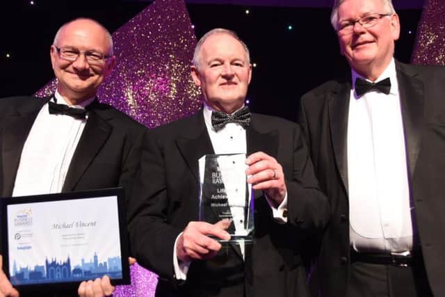 Lifetime achievement award for Michael Vincent, centre, with PT editor Mark Edwards, left and Chris Collier, chairman of the PT awards judges.
