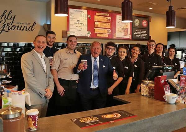 Barry Fry and Jack Baldwin with staff at the new Costa in Hampton. Photo: Joe Dent