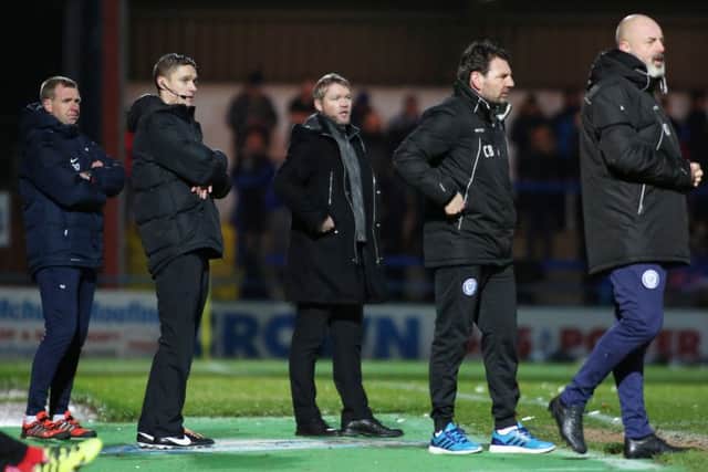 Posh manager Grant McCann (centre) looks on at Rochdale. Photo: Joe Dent/theposh.com.